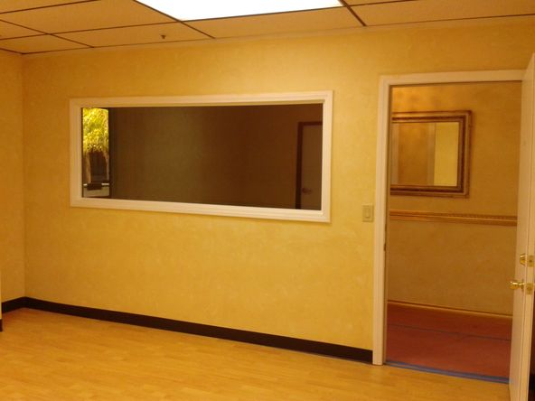 LARGE PRIVATE OFFICE, MULTIPLE USES. WOOD FLOOR.